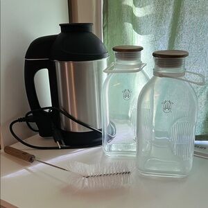 Almond Cow nut milk maker with glass storage bottles and bottle brush